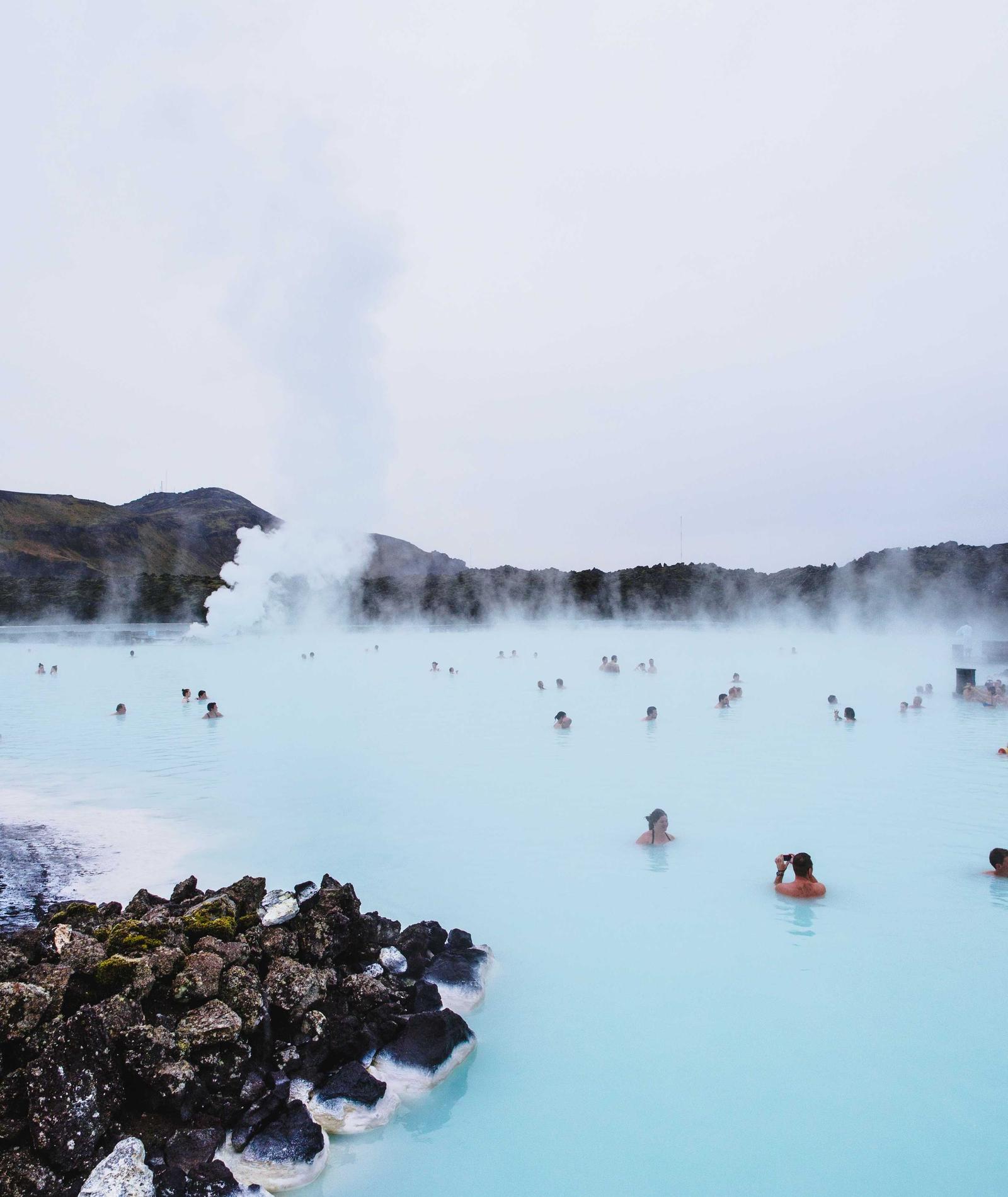 Steam rising from blue thermal pools