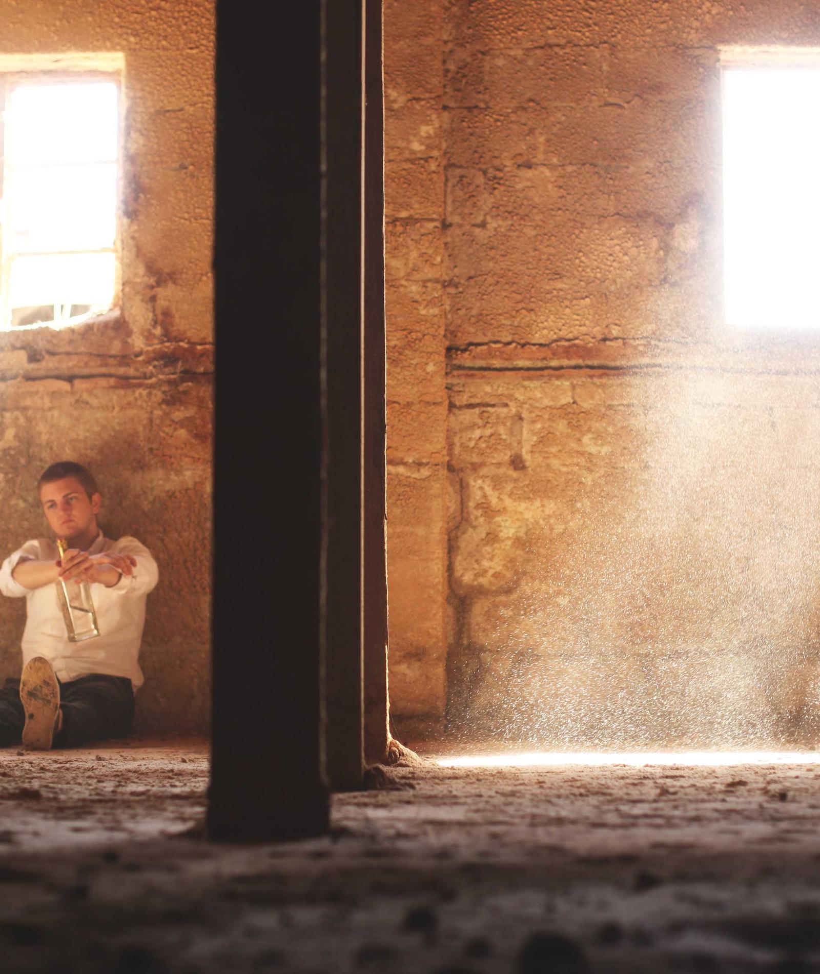 Morning sun pouring through the doors of a timber barn